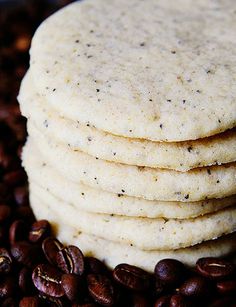 a stack of flatbreads sitting on top of coffee beans next to each other