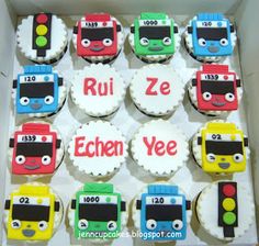 decorated cupcakes in the shape of buses with names and numbers on them are shown