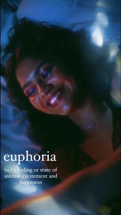 a woman laying in bed with the caption euphora