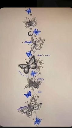 a drawing of butterflies on a white sheet with blue writing in the bottom right corner