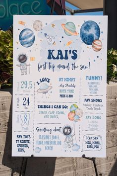 a sign that says, ka's first trip around the sun with pictures of planets on it