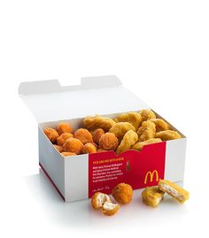 an open mcdonald's box filled with chicken nuggies