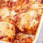 a casserole dish with meat and cheese on it, ready to be eaten