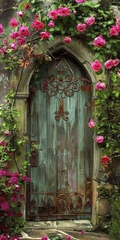 an old wooden door surrounded by flowers and greenery with pink roses growing over it