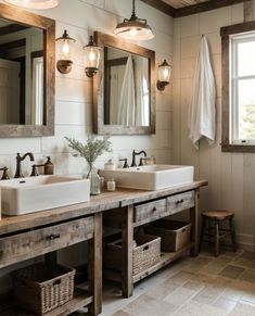 a bathroom with two sinks and mirrors in it