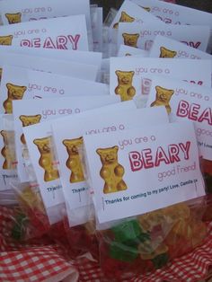 there are many bags of bear candy on the table