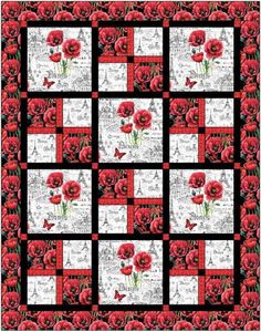 a red and black quilt with flowers on it