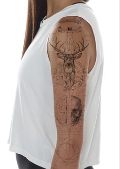 a woman with a tattoo on her arm and shoulder is standing in front of a white background