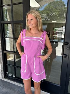 Solid square neck sleeveless romper featuring ric rac trim. Pocket at sides. Smocking and zipper closure at back. Adjustable straps. Lined. Woven. Non-sheer. Lightweight. 49% rayon 34% polyester 17% nylon Model is 5'2" with a 25" waist, 31" hips and a 32" Bust and is wearing a small. Fits true to size Summer Beach Jumpsuits And Rompers With Square Neck, Summer Beach Jumpsuits With Square Neck, Summer Jumpsuits And Rompers With Square Neck, Trendy Spring Jumpsuits And Rompers With Square Neck, Trendy Square Neck Jumpsuits And Rompers For Summer, Chic Summer Jumpsuits And Rompers With Square Neck, Spring Square Neck Jumpsuits And Rompers, Summer Beach Jumpsuits And Rompers With Lace Trim, Chic Spring Jumpsuits And Rompers With Lace Trim