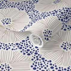 a blue and white wallpaper with an abstract design on the back side of it