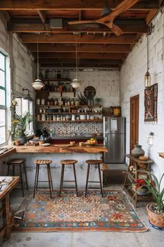 an industrial style kitchen with wooden stools