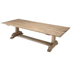 a large wooden table with two legs and a long slab on one end, against a white background