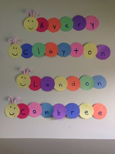 the wall is decorated with different colored paper circles and some words that spell out'avery clayton '