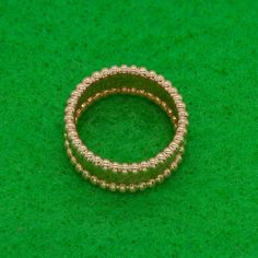 Van Cleef & Arpels Perlée Ring in 18k rose gold with beaded rims. Van Cleef & Arpels is engraved on band. Ring band is 8mm band.  Ring Size: 50 (US-5.5)  Approximate Gross Weight: 8.0 grams  Estimate Retail $2600  Hallmarks: VCA, Au750, 50, serial number  Other: Copy of Purchase receipt available Luxury Rose Gold Round Band Jewelry, Luxury 14k Gold Jewelry With Milgrain Detail, Luxury 14k Gold Milgrain Jewelry, Luxury Yellow Gold Rings With Milgrain, Luxury Yellow Gold Rings With Milgrain Detail, Luxury Yellow Gold Milgrain Rings, Rose Gold Decorative Band, Luxury Milgrain Jewelry For Gifts, Luxury Milgrain Round Band Jewelry