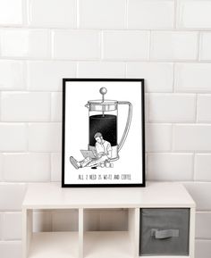 a black and white poster sitting on top of a shelf