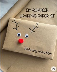 an envelope with a reindeer face on it and the words diy reindeer wrapping paper kit