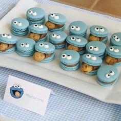 there are many blue cupcakes with eyes on the plate next to each other