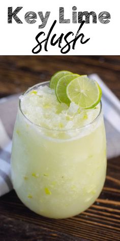 key lime slush in a small glass on a wooden table with text overlay that says key lime slush