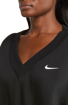 Minimally branded with an embroidered Swoosh, this classic sweatshirt is reimagined with a V-neck and cropped length. 19" length (size Medium) V-neck Ribbed cuffs and hem 80% cotton, 20% polyester Machine wash, tumble dry Imported Sporty V-neck Sweatshirt For Fall, V Neck Sweatshirt, Nike Crew Neck Athleisure Sweatshirt, Nike Casual Sweatshirt With Moisture-wicking, Nike Casual V-neck Top, Oversized Sporty V-neck Sweatshirt, Sporty Cotton V-neck Sweatshirt, Sporty V-neck Sweatshirt With Ribbed Cuffs, Crop Sweatshirt