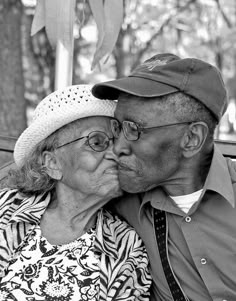 an older couple kissing each other while sitting on a bench with the caption 70 plus years of marriage