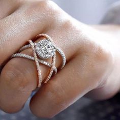 a woman's hand with two rings on it