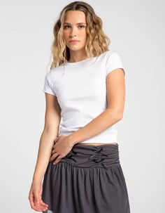 Tilly's Crew Tee. Solid Tee. Rib Knit Construction. Crew Neckline. Short Sleeve. Fitted Silhouette. 60% Cotton, 35% Polyester, 5% Spandex. Machine Wash. Imported. Model Is Wearing A Size Small. Model Measurements:height: 5'9" Bust: 32"waist: 25"hips: 35" | Tillys Crew Tee Casual Short Sleeve Crew Neck Top In Elastane, Casual Short Sleeve Top For Summer, Basic Stretch Knit Top With Short Sleeves, Casual Short Sleeve Summer Top, Casual Spring Knit Top, Fitted Short Sleeve Basic Knit Top, Basic Fitted Short Sleeve Knit Top, Fitted Short Sleeve Knit Top, Basic Stretch Cotton Knit Top