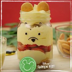 a glass jar filled with food sitting on top of a table