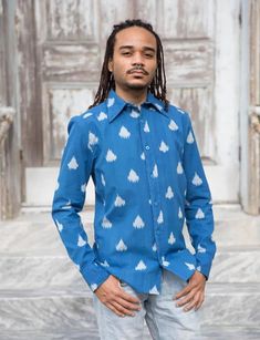 This long sleeve men's button down shirt features a rich cobalt blue color with hand dyed ikat triangles. Gentle tapering at the waist with a straight and narrow profile and a broader fit in the shoulders gives this shirt the perfect fit. Due to the handmade nature of this item, slight color variation may occur. Collar Model, Men's Button Down Shirt, Ikat Fabric, Unique Shirt, Men's Wardrobe, Cobalt Blue, Fair Trade, Mens Long Sleeve, New Orleans