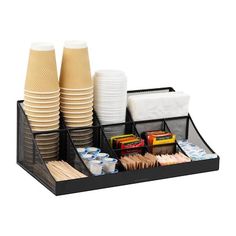 a tray with cups and plates in it