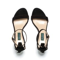 An elegant and minimal silhouette for when you want to feel a little flirty. We designed this 70mm heel to be extra stable so you can comfortably stand, walk, strut, and dance. Our Tacco features a stabilizing ankle strap with adjustable buckle, a covered back with tassel embellishment, and a padded insole to provide comfort to your feet. Made in soft black suede, the Tacco is a classic that you can wear for any occasion. This style is also available in Tan + Navy Suede and Rich Red Nappa. Evening Kitten Heels With Ankle Strap, Evening Block Heel Kitten Heels With Heel Loop, Evening Kitten Heels With Heel Loop And Block Heel, Sleek Ankle Strap Kitten Heels With Padded Heel, Sleek Kitten Heels With Ankle Strap And Padded Heel, Chic Evening Block Heels With Heel Loop, Classic Low Heel Block Heels For Party, Sleek Kitten Heels With Heel Loop For Evening, Sleek Kitten Heels With Ankle Strap And Wrapped Heel