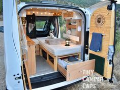 the interior of a camper van with its doors open