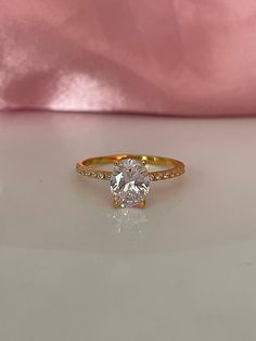 New in from our 2022 collection. The ring is on promo sale at 30% off! Beautiful Yellow Gold Vermeil Engagement Ring with the finest 2CT oval cut simulated diamond 💎This radiant engagement ring features 2CT oval cut stone on fine 1.5mm Yellow Gold Vermeil band 💎Made of high quality sterling silver and heavy plated with yellow gold it is guaranteed not to rust or turn your finger green. *Even though we apply thick layer of gold we strongly recommend to avoid water and harsh chemicals to make su Oval Gold Wedding Ring With Center Stone, Dazzling Oval Gold Wedding Ring, Oval Gold Moissanite Rings, Gold Oval Diamond Ring With Vs Clarity, Gold Oval Diamond Ring With Center Stone, Oval Gold Diamond Ring With Center Stone, Gold Oval Cubic Zirconia Diamond Ring, Radiant Engagement Ring, Radiant Engagement