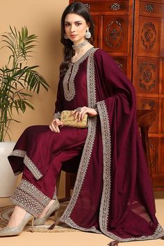 Maroon Silk Blend Solid Embroidered Straight Palazzo Bottom Suit Set Introducing our Maroon Silk Blend Solid Embroidered Straight Palazzo Bottom Suit Set. Made with luxurious silk blend fabric, this set features delicate embroidery and a flattering straight cut palazzo bottom. Add a touch of elegance and style to your wardrobe with this versatile and timeless piece. Please Note : Colors can vary. This set looks more purple in light. Size up for a comfortable fit.Style NoteComplete the LookYou'll Mehrun Color Suit, Silk Suit Designs Indian Latest, Silk Pakistani Suits, Velvet Suits Women Indian Party Wear, Maroon Salwar Suit, Suit Designs Indian Style Party Wear, Silk Suit Designs Indian, Velvet Suits Women Indian, Wine Color Suit