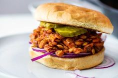 a sandwich with beans and avocado on a plate