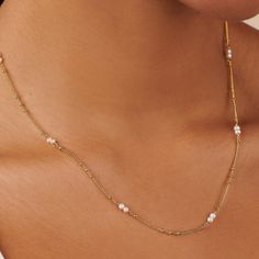 Introducing the epitome of understated elegance: a dainty bead pearl necklace that marries the timeless charm of pearls with the delicate allure of fine gold chain. Each pearl is carefully selected and spaced along the golden strand, creating a symphony of subtle sophistication that dances gracefully upon the neck.  Crafted from premium brass and beautifully adorned with a thick layer of 14K gold plating.  Hypoallergenic, nickel and lead-free. Tarnish resistant. 14k gold over sterling silver and freshwater pearl H2O sensitive. Before showering or working out, remove your plated jewelry. Clean your piece by buffing gently with a dry cloth and store it in your pouch. Bead Pearl Necklace, Beaded Pearl Necklace, September Birthstone Jewelry, Forever Jewelry, Jewelry Ring Box, Pearl Jewellery Earrings, Men's Jewelry Rings, Evil Eye Jewelry, Understated Elegance