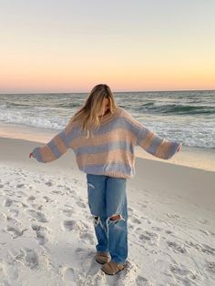 The Poppy Blush and Blue Striped Oversized Sweater is the coziest and cutest sweater for your day-to-day outfits! Blush and blue striped fabric shape this oversized sweater with a round neck, a tunic length, and bubble sleeves. Features ribbed accents at the hem. Style your favorite baggy jeans for a casual look. DETAILS & CARE 55% Cotton/30% Acrylic/15% Nylon Hand wash cold. Imported. Costal Grandaughter Aesthetic Outfits, Cute Cold Beach Outfits, Sweater At The Beach, Windy Beach Outfit, Jeans And A Sweater Outfit, Coastal Grandma Style Outfits, Sweaters And Jeans Outfit, Cold Coastal Outfit, Cute Casual Comfy Outfits