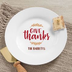 a white plate with the words give thanks on it