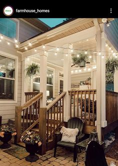 a porch covered in string lights next to a house