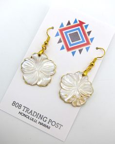 "Genuine Gold Lip Mother of Pearl Hawaiian Style Flower Style Earrings with Gold Plating Hand Made with Stainless Ear Wires Free Shipping.  Vivid colors with some beautiful variations that are natural for the Gold Lip shell used to culture Tahitian Gold south sea pearls.  Earrings are over 1\" in diameter with a drop about 2 inches off the ear.  Accented with gold plating on the edges. Stainless steel ear wires for your safety.  Ships for FREE direct to your home or office." Gold Flower-shaped Earrings For Beach, Gold Flower Earrings For Beach, South Sea Pearls Earrings, Gold Lips, Pearls Earrings, Flower Style, Sea Pearls, Hawaiian Style, South Sea Pearls