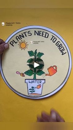 a person holding up a sticker that says plant's need to gorn