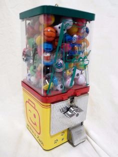 a toy machine filled with lots of different colored balls