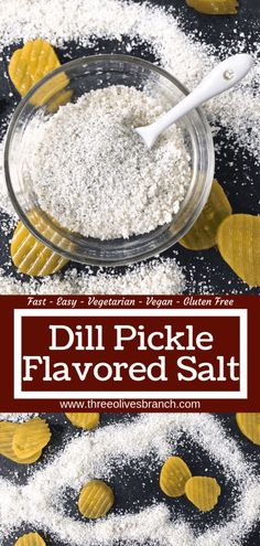 the ingredients for dill pickle flavored salt in a glass bowl on a black and white background