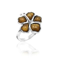 a silver ring with brown stones in the shape of four leaf clovers on it