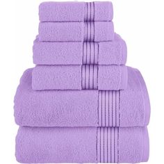 six purple towels stacked on top of each other