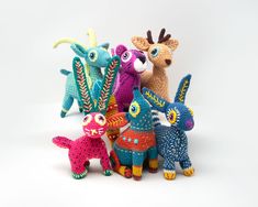 several knitted animals sitting next to each other