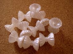 several small plastic shells sitting on the floor