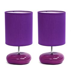 two purple lamps are next to each other