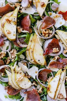 a salad with pears, onions and walnuts