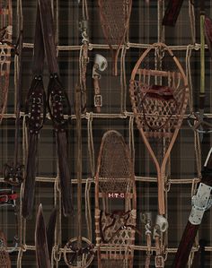 a wall with lots of different types of shoes on it and ties hanging from them