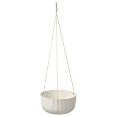 a white pot hanging from a metal chain